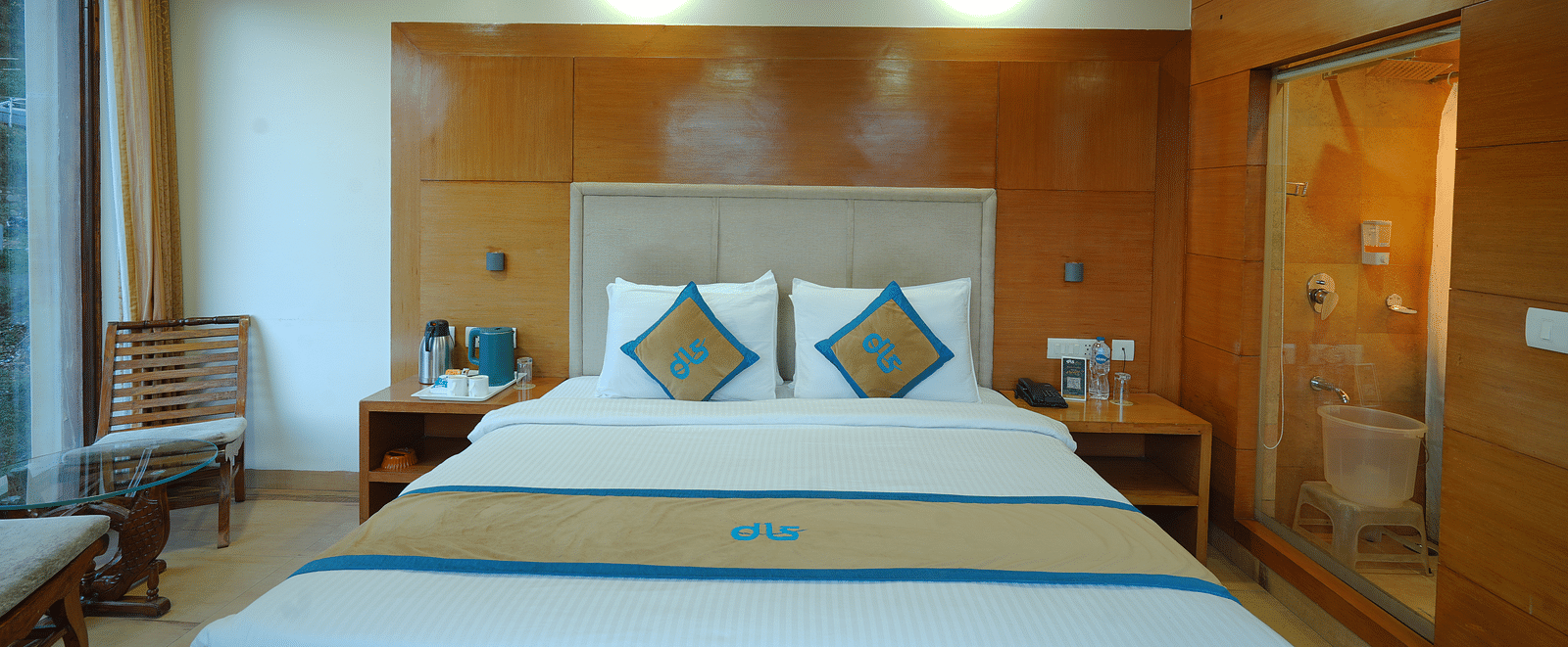 A room featuring a bed and white lights illuminating from the ceiling at DLS Hotels The Rock Castle.